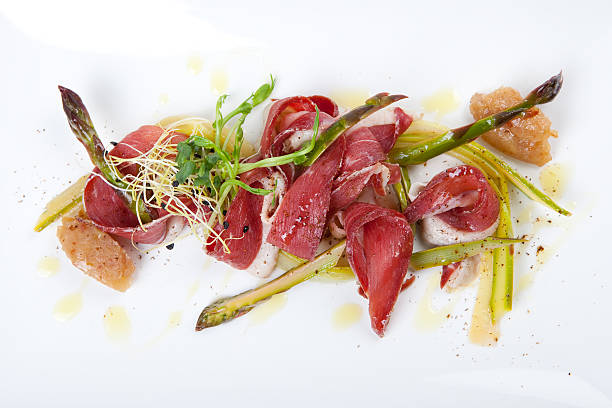istock marinated green asparagus with smoked duck breast and banana chutney 470636244