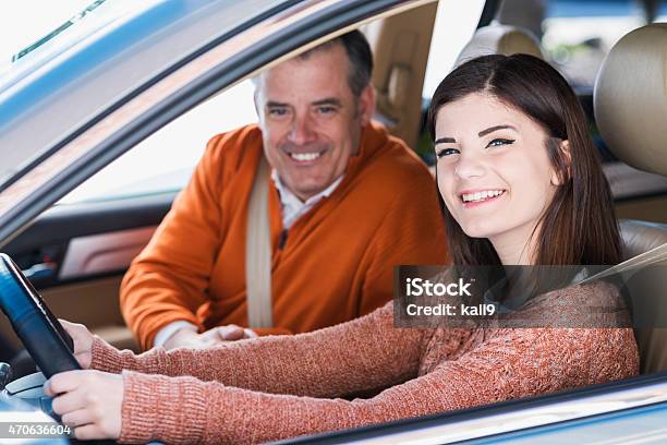 Teenager With Father Learning To Drive Stock Photo - Download Image Now - Teenager, Driving, Car