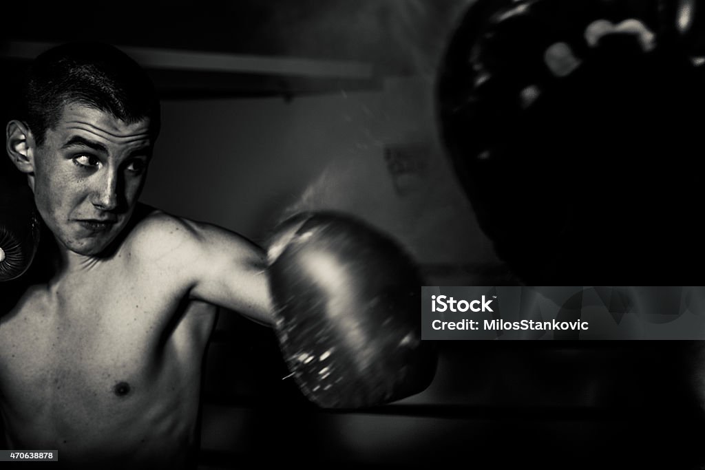 Kick boxer punches Young male boxer practicing punches 2015 Stock Photo