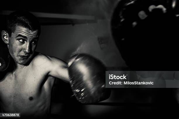Kick Boxer Punches Stock Photo - Download Image Now - 2015, Active Lifestyle, Activity