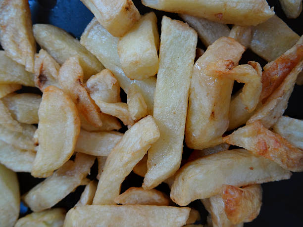 istock Image of greasy chips from takeaway fish and chip shop 470640116