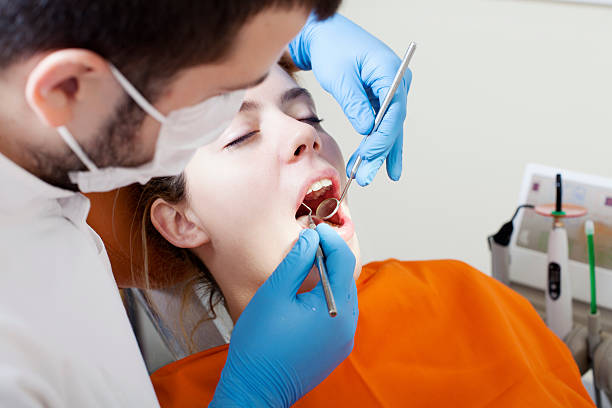 istock Woman having teeth examined at dentists 470640218