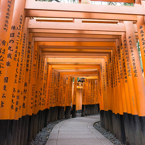 Kyoto, Japan - March 15, 2015: The famous Fushimi Inari Taisha shrine in Kyoto, Japan.  The shrine is a UNESCO world heritage site and a major tourist attraction in Kyoto.