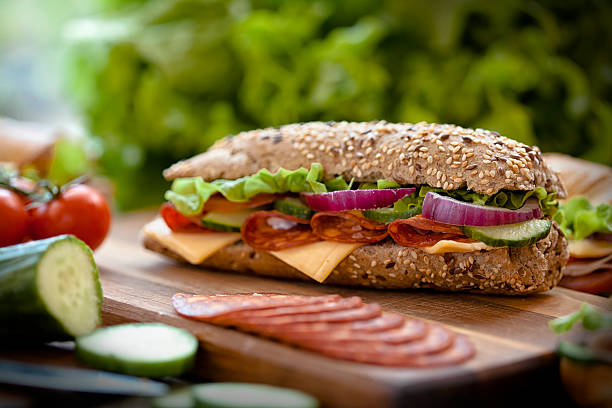  tasty sandwiches on a wooden table 