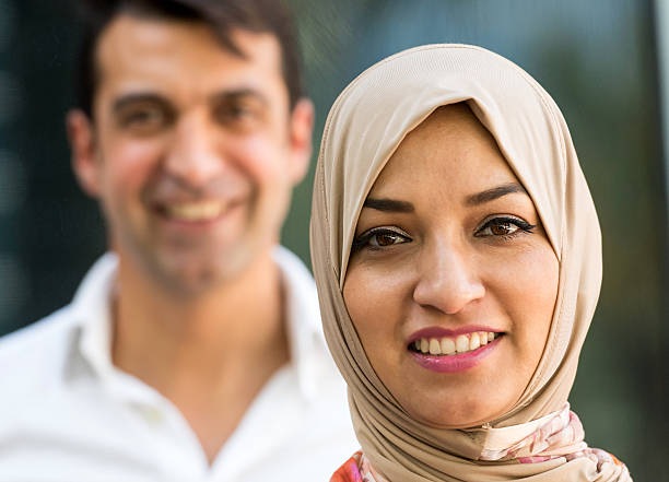 istock Happy Muslim woman with man in soft focus. 470641532