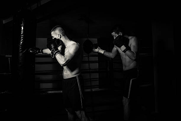 istock Two kick boxers boxing workout in gym 470642058