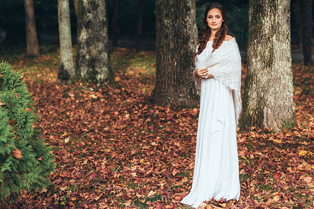 Three beautiful bride on a background of autumn forest