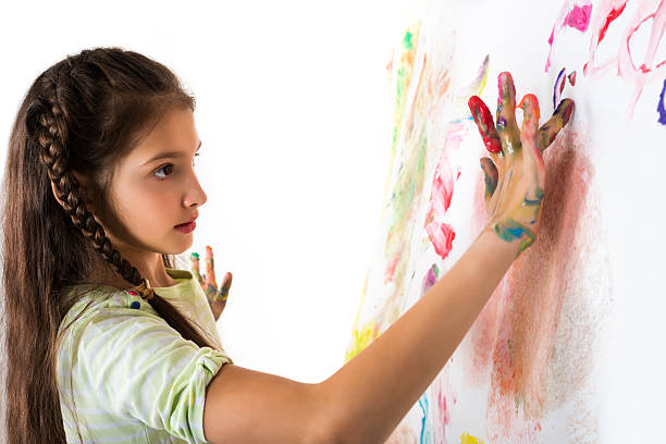 istock Girl draws fingers on paper wall 470642502