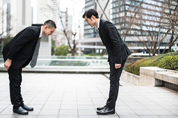 istock japanese Business greetings together on the downtown 470643828