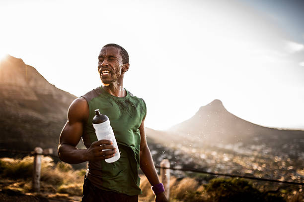 istock Tired African American athlete with water splashed onto his face 470643966
