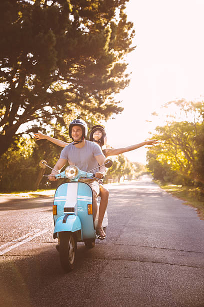 istock Couple road tripping on their scooter feeling free 470648150