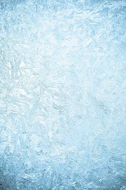 Background of a frosted over window Close-up shot of some icy-flowers on a window ice crystal photos stock pictures, royalty-free photos & images