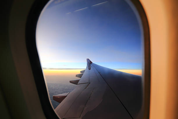 istock Window airplane Travel time is sunset. 470651041