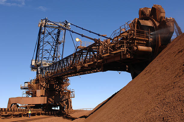 istock Iron ore reclaimer and iron ore stockpile 470651438