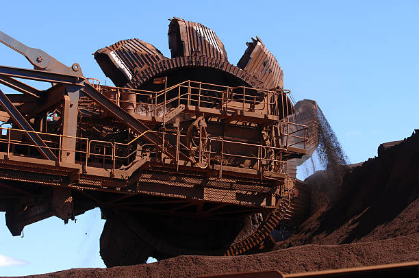 istock Iron ore reclaimer and iron ore stockpile 470651452