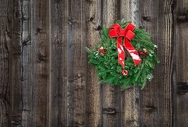 istock Holiday wreath on rustic wooden fence 470651829