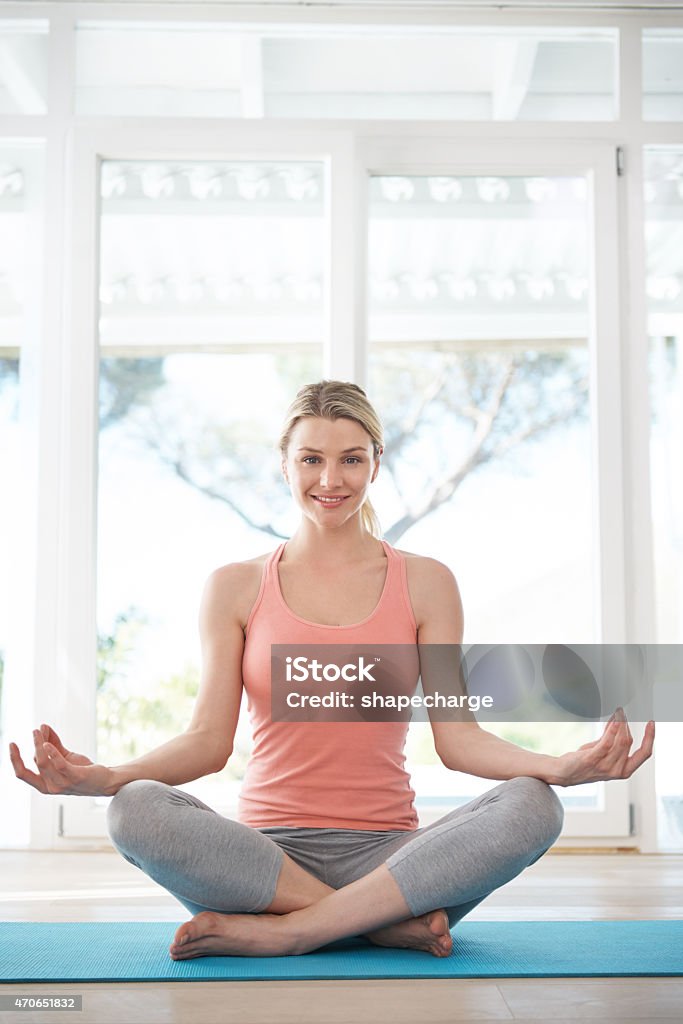 Refresh your mind and body Shot of a beautiful woman sitting in the lotus positionhttp://195.154.178.81/DATA/i_collage/pu/shoots/799357.jpg Yoga Stock Photo