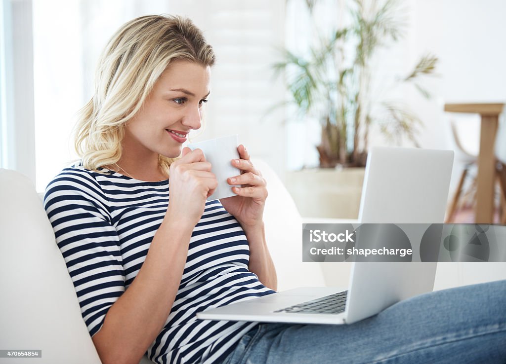 Coffee and connectivity Cropped shot of an attractive young woman drinking coffee while surfing the nethttp://195.154.178.81/DATA/i_collage/pu/shoots/799282.jpg 20-29 Years Stock Photo