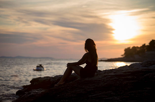 istock Girl at the sea 470656422