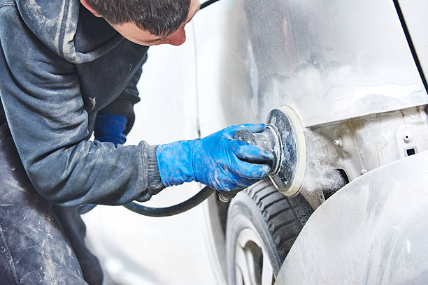 istock mechanic polishing car body 470656444