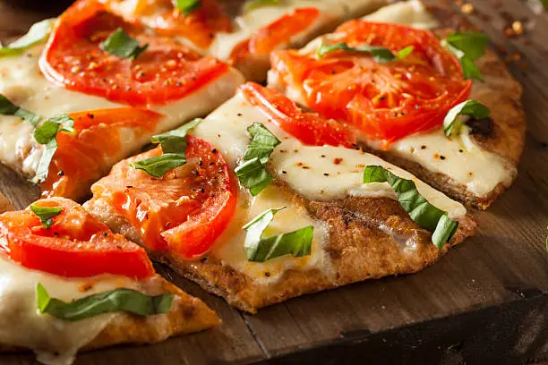 Homemade Margarita Flatbread Pizza with Tomato and Basil