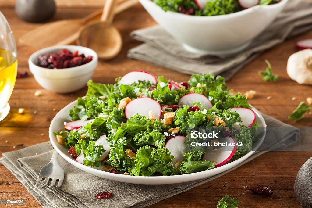 Healthy Raw Kale and Cranberry Salad Healthy Raw Kale and Cranberry Salad with Cheese and Nuts 2015 Stock Photo