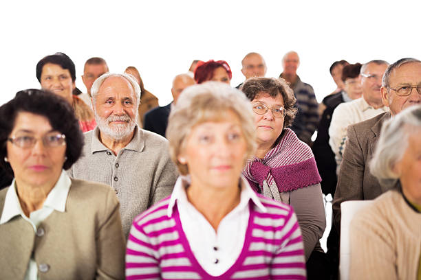istock Large group of seniors paying attention on education event. 470661236