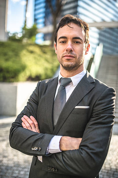 istock Successful business man with arm crossed 470665940