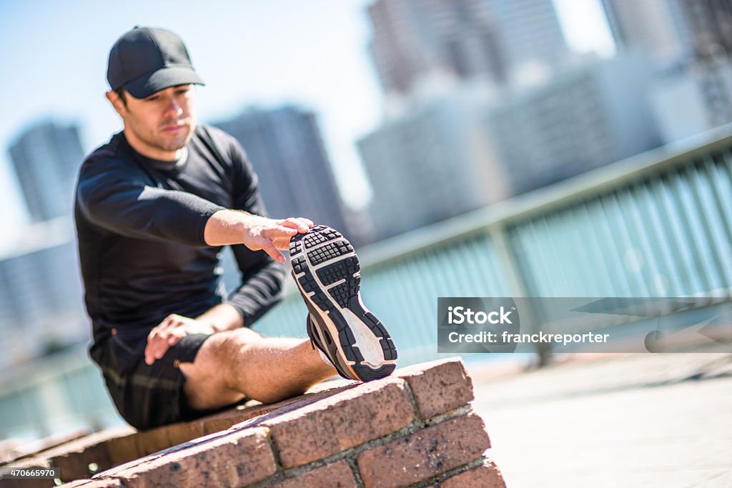 man doing stretching on the city 20-29 Years Stock Photo