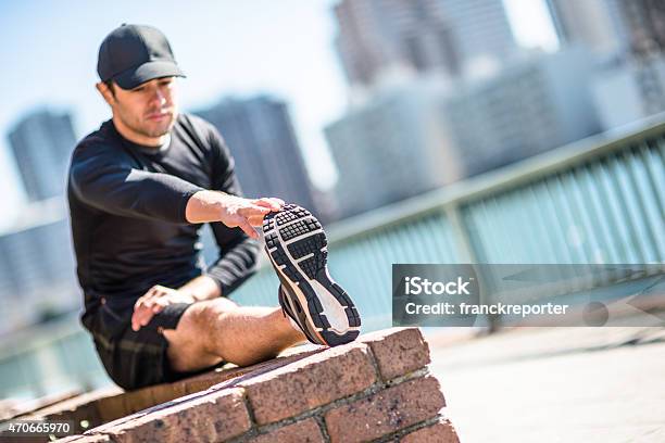 Man Doing Stretching On The City Stock Photo - Download Image Now - 20-29 Years, 2015, 30-39 Years