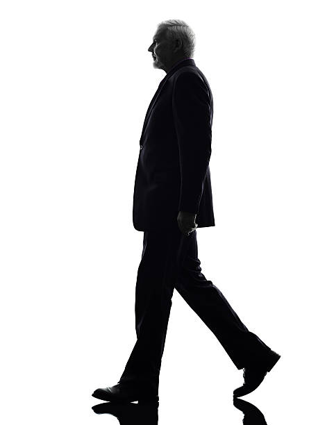 istock senior business man walking silhouette 470668813