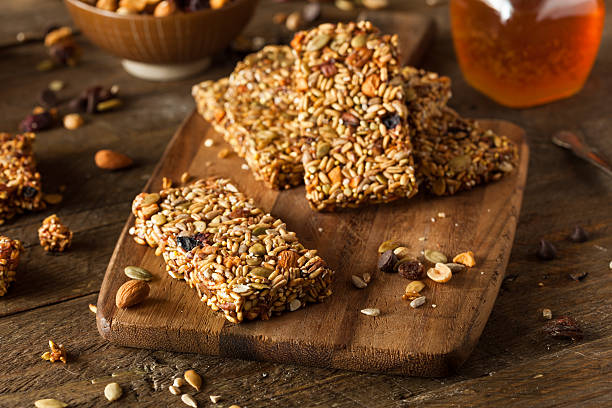 istock Raw organic granola bars sitting on a cutting board on table 470670342