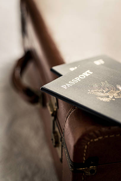 istock Old Fashioned Suitcase on a Bed with Passports 470672841