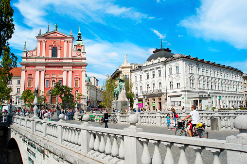 Ljubljana, Slovenia - September  02, 2013: People at Triple Bridge and Preseren Square  in Ljubljana. This year Ljubljana city is competing for the title of European Green Capital 2016