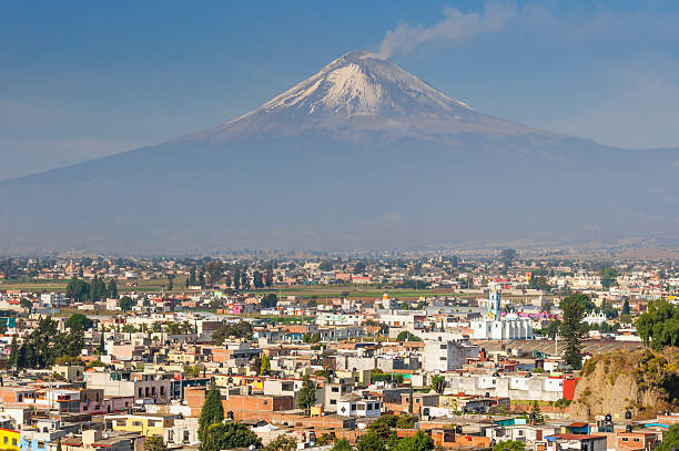 Popocatepetl volcano seen from Cholula (Mexico) stock photo