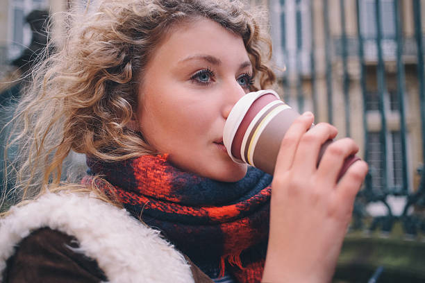 istock City student sipping a takeaway coffee on a winter day 470674026
