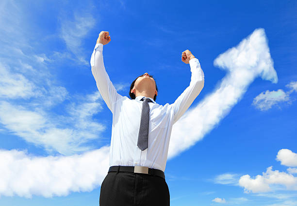 istock successful business man arise arms 470675341