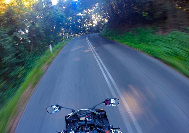 istock Motorbike going at speed along a nice road 470678984
