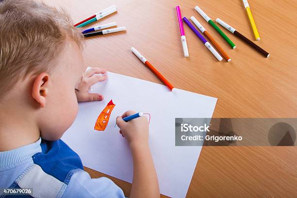 Small Boy Draws Stock Photo - Download Image Now - 2015, Activity, Boys