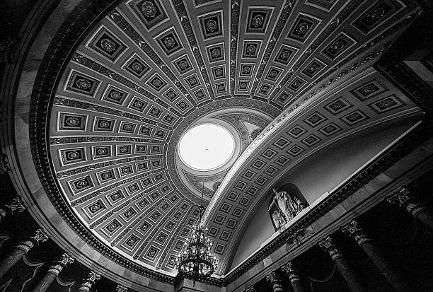 Ceiling Of The Old House Of Representatives Chamber A wide angle view of the ceiling of the rotunda of the United States House of Representatives chambers in the US Capitol building that shows the ceiling panels and the oculus of the dome. (Scanned from black and white film.) rotunda stock pictures, royalty-free photos & images