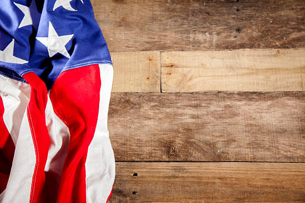 istock USA flag makes left border. Wooden boards background. 470685162