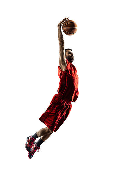 istock Isolated basketball player in action is flying high 470689086