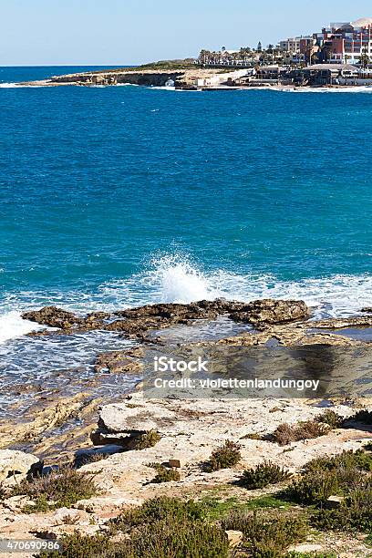 Beach And Buildings In Buġibba Malta Stock Photo - Download Image Now - Architecture, Balcony, Bay of Water
