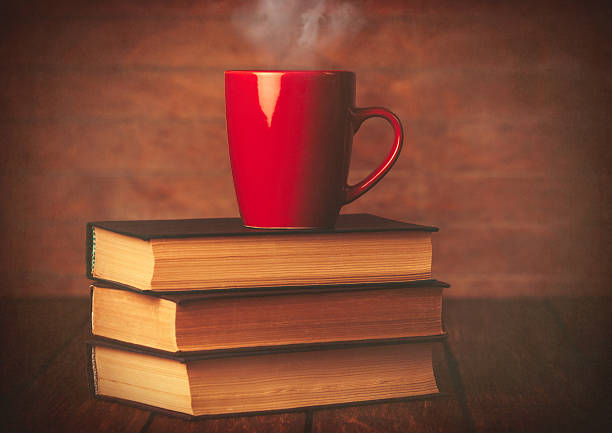 istock Cup of coffee and books 470697770