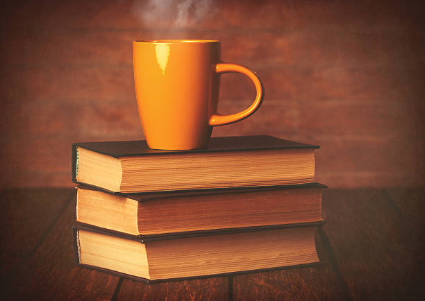 istock Cup of coffee and books 470697898