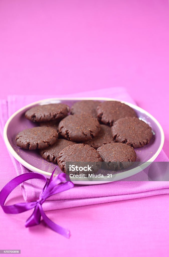 Vegan Chocolate Raspberry Cookies Vegan Chocolate Raspberry Cookies in a purple plate on a purple background. 2015 Stock Photo