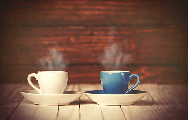 istock Two cups of coffee on wooden table 470701160