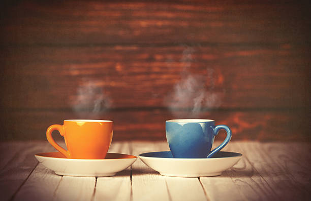 istock Two cups of coffee on wooden table 470702142