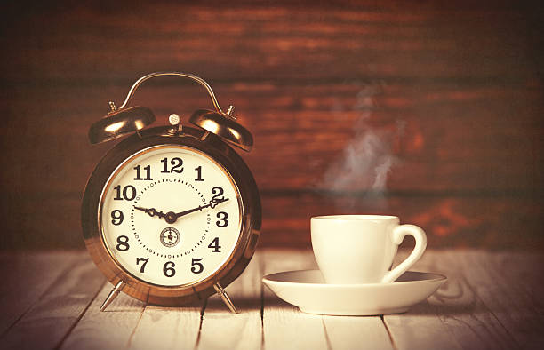 istock Cup of coffee and alarm clock 470702158