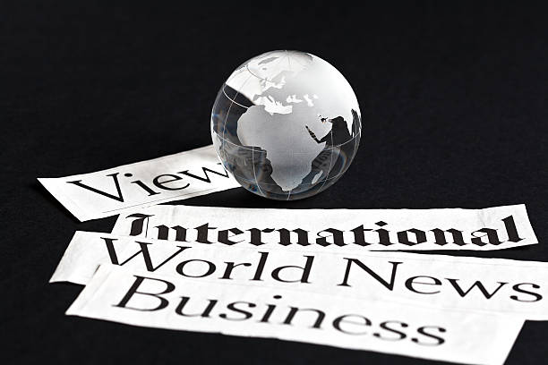 istock crystal globe and newspaper cut outs 470706168